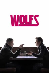 The image shows a promotional poster for the movie Wolfs, featuring George Clooney and Brad Pitt sitting across from each other at a table, both engaged in what appears to be a tense conversation. The title "Wolfs" is prominently displayed at the top in bold, large, red text, with a clean and minimalist white background. Both actors are dressed in casual, dark attire, emphasizing a serious tone, possibly hinting at their roles as lone fixers who must work together. The design is simple, focusing on the intensity of their interaction, which aligns with the action-comedy genre the movie represents.